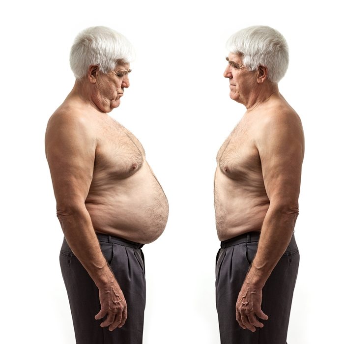 Overweight man and regular weight man over white background